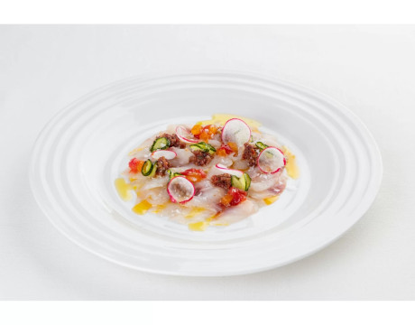 Sea bass crudo with olive tapenade and spicy sauce