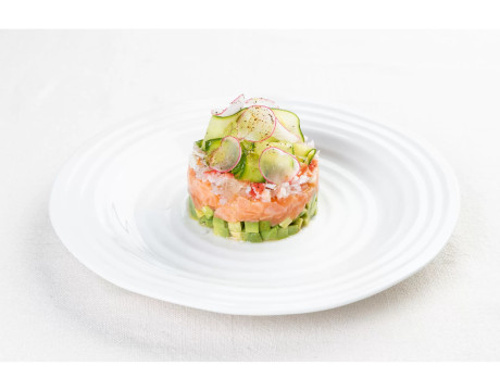 Salmon tartare with avocado, crab and cucumber slices